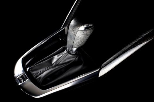 Car gear stick with shifter in automotive interior, automatic transmission for vehicle control. photo