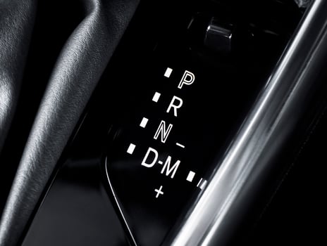 Closeup of car gear selector, automatic transmission display. Shifter, P R N D M modes. photo