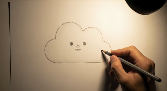 Hand drawing a minimalist cartoon cloud with a friendly face on white paper photo