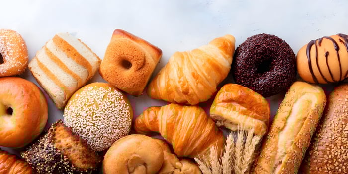 Assortment of Fresh Baked Breads Croissants Donuts and Pastries Bakery Food photo