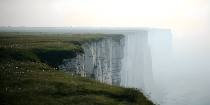 Dramatic White Cliffs Grassy Top Misty Ocean View photo