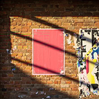Pink Crumpled Poster Mockup on Brick Wall with Sunlight photo