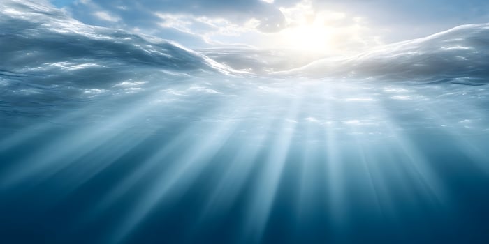 Underwater Ocean Scene Sunlight Rays Blue Water Surface photo