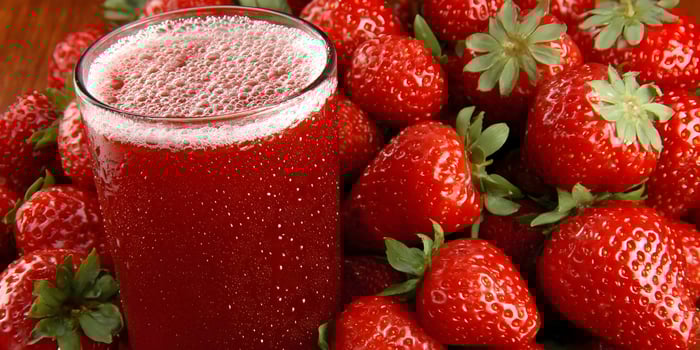 Glass of Strawberry Juice with Fresh Strawberries photo