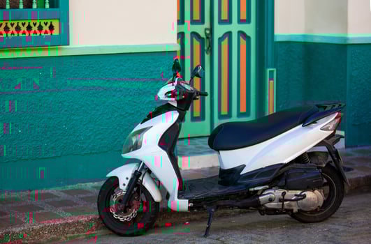 Motorcycle at the beautiful streets of the Heritage Town of Jerico located in the Department of Antioquia in Colombia. photo