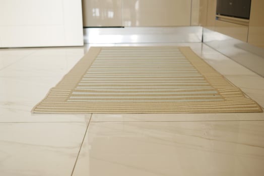 Kitchen rug on tiled floor in a modern setting photo