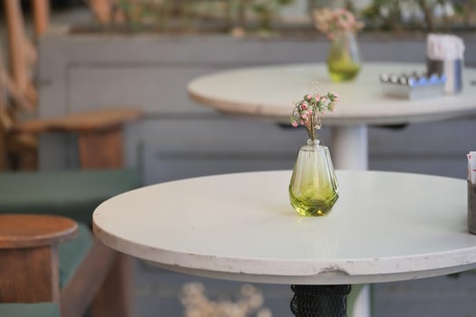 Decorative vase on a table in a cozy cafe setting photo