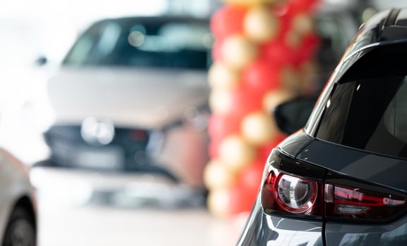 Car parked in elegant showroom. Car dealership office. Car showroom business. New car parked in modern showroom. Auto for sale and rent business. Automobile leasing and insurance. Electric automobile. photo