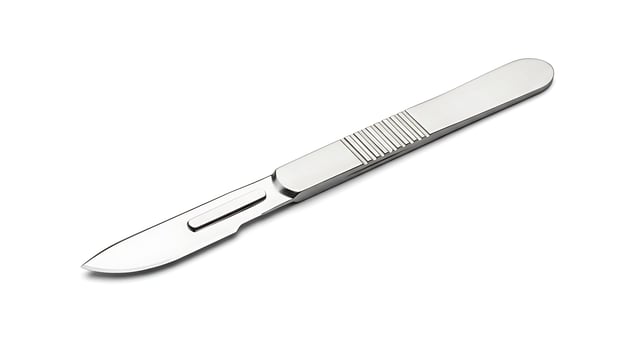 Stainless Steel Scalpel Blade on White Background for Medical Usage photo