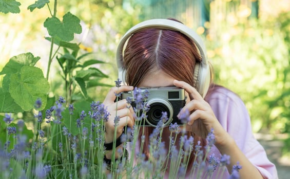 Photographer capturing nature with vintage camera photo