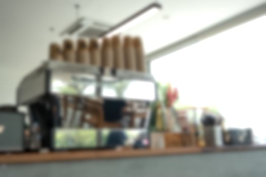 Blur the background of the coffee machine standing on a wooden countertop photo