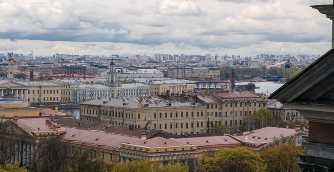 Stunning Panoramic View of St Petersburg Showcasing Historic Architecture and a Cloudy Skyline Over the Neva River photo