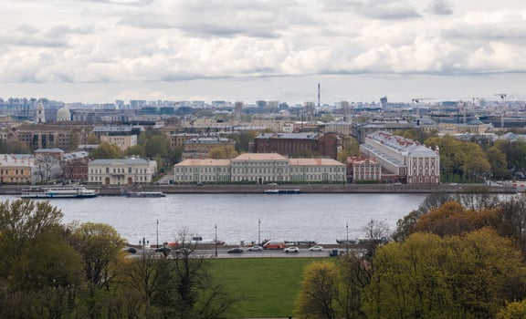 Cityscape Showing Historical Buildings and a River in St Petersburg During a Cloudy Day photo