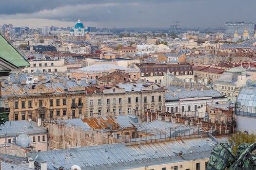 St. Petersburg Skyline Showcasing Historic Architecture and Rooftops Under a Cloudy Sky photo