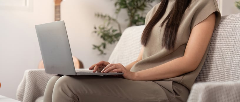 Focused Work and Digital Engagement. Young woman typing on laptop. photo