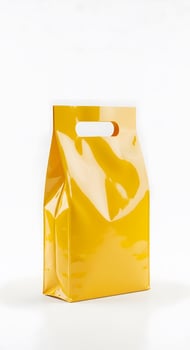 Vibrant Yellow Die-Cut Handle Bag for Retail, A Standout Packaging Solution Against a Clean White Background photo