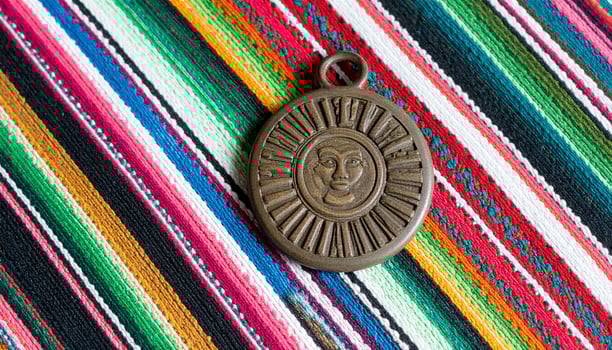 Mayan Seal Fragment On Guatemalan Textile photo