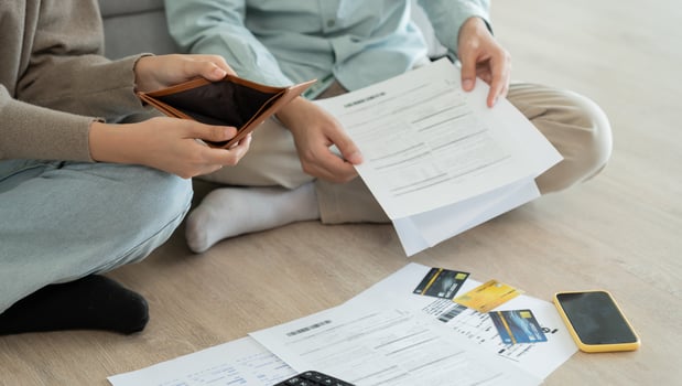 Stressed and headache asian couple with large bills or invoices no money to pay to expenses and business problem. shortage, Financial problems, mortgage, loan, bankruptcy bankrupt photo