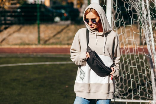Model girl with waist bag, street photo