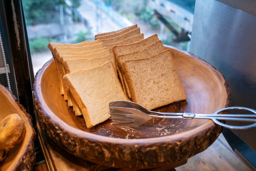 Tasting fresh slices of bread local bakery culinary delight urban setting close-up view food appreciation photo