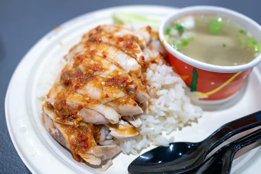 Delicious chicken rice dish local food stall culinary experience urban setting close-up view flavorful feast photo
