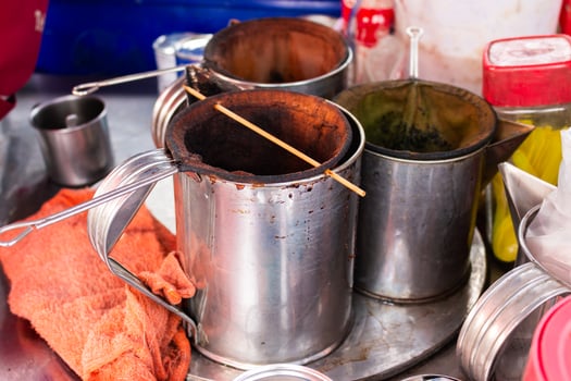 Tea brewing scene local market food urban setting close-up view cultural experience photo