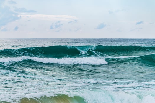 Waves crashing at the seaside coastal landscape nature serene environment aerial view marine beauty photo