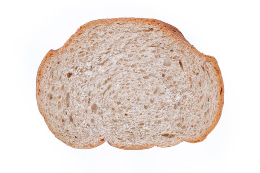 Sliced whole wheat bread isolated on white photo