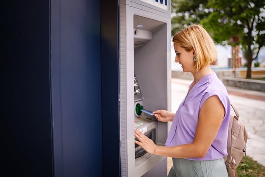Enjoying summer in Greece while using an ATM machine photo