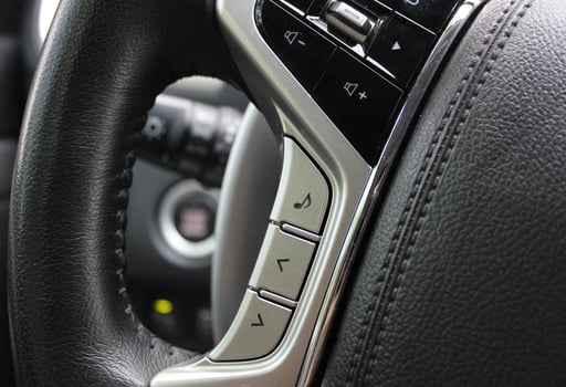 Touch control unit for the volume of the sound system and voice control on the steering wheel of the car photo