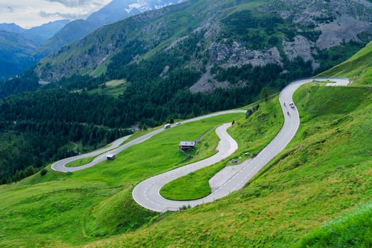 Discover the breathtaking alpine road in Zell am See-Kaprun, Austria. This stunning image showcases winding paths and lush landscapes, capturing the essence of adventure in the Austrian Alps. photo