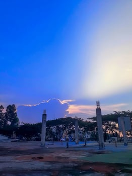 Serene Twilight Construction Site Silhouette Against a Vibrant Sunset Sky photo