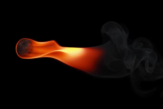 one fireball with smoke isolated on black photo