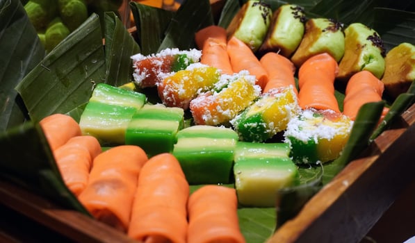 A tray of food with carrots, cucumbers, and other vegetables photo