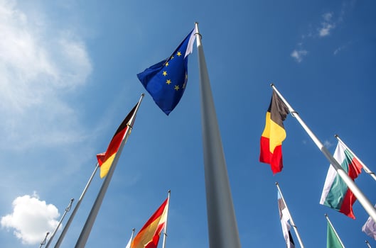 Flags of the European Union, Germany, and Belgium waving in the wind photo