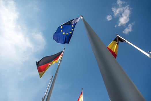 Flags of the European Union, Germany, and Belgium waving in the wind. photo