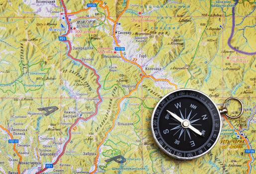 Compass on a map close photo