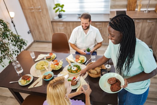 Friends share a tasty meal in a cozy kitchen photo