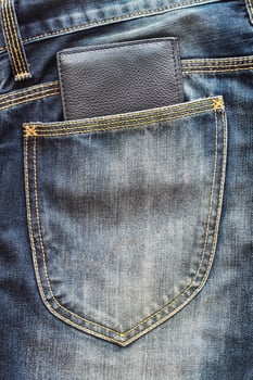 black wallet on jeans pocket photo