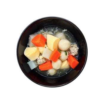 egg tofu soup in black bowl isolated on white photo