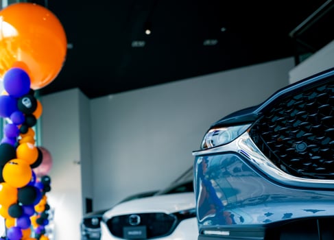 Car parked in luxury showroom. Car dealership office. Car showroom business. New car parked in modern showroom. Auto for sale and rent business. Automobile leasing and insurance. photo