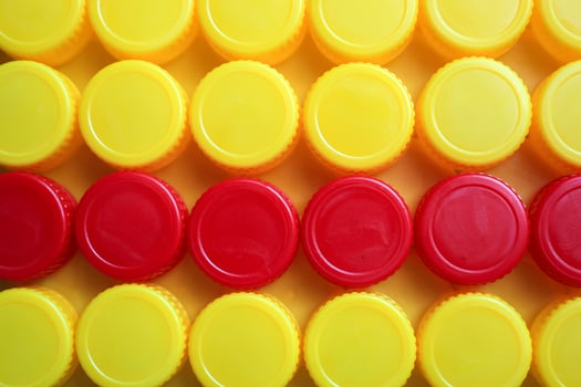 Yellow and Red Plastic Bottle Cup Background photo