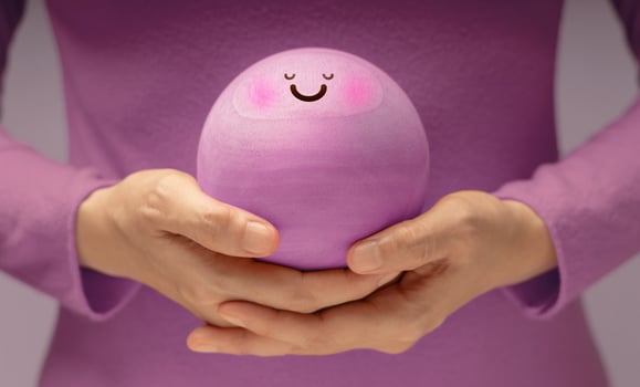 Hands gently holding Smiling Circle face. Mental health, emotional balance,inner peace through meditation and mindfulness. symbolizing good mental and self-awareness photo