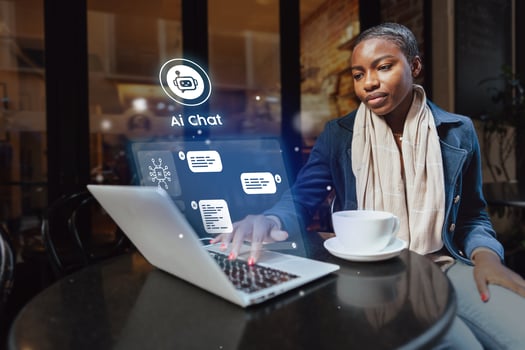 Young woman engages in virtual conversation at a cafe, using laptop in a modern workspace during the day photo