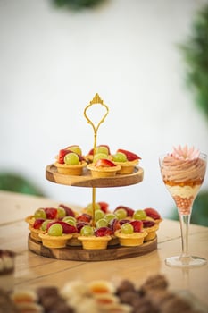 Fruit tarts on wooden stand photo