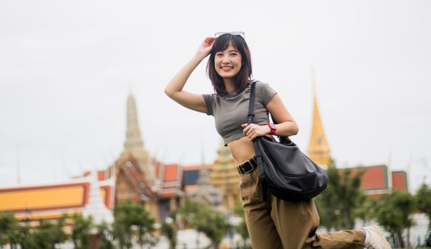 Happy solo southeast asian woman and teenager blogger enjoying world travel tourism concept. local cultural experience for an explorer in Bangkok Asia tourism in Thailand photo