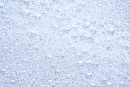 Thick soap foam with bubbles. photo
