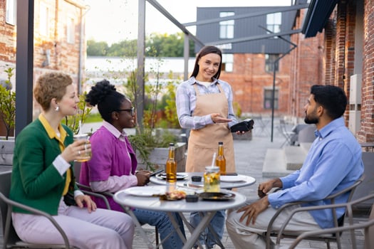 Friends dining outdoors at a cafe photo