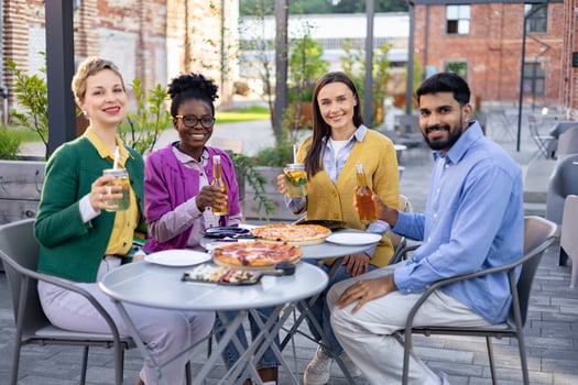 Group of friends dining outdoors photo