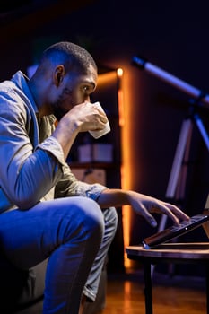 Man working on laptop at night photo